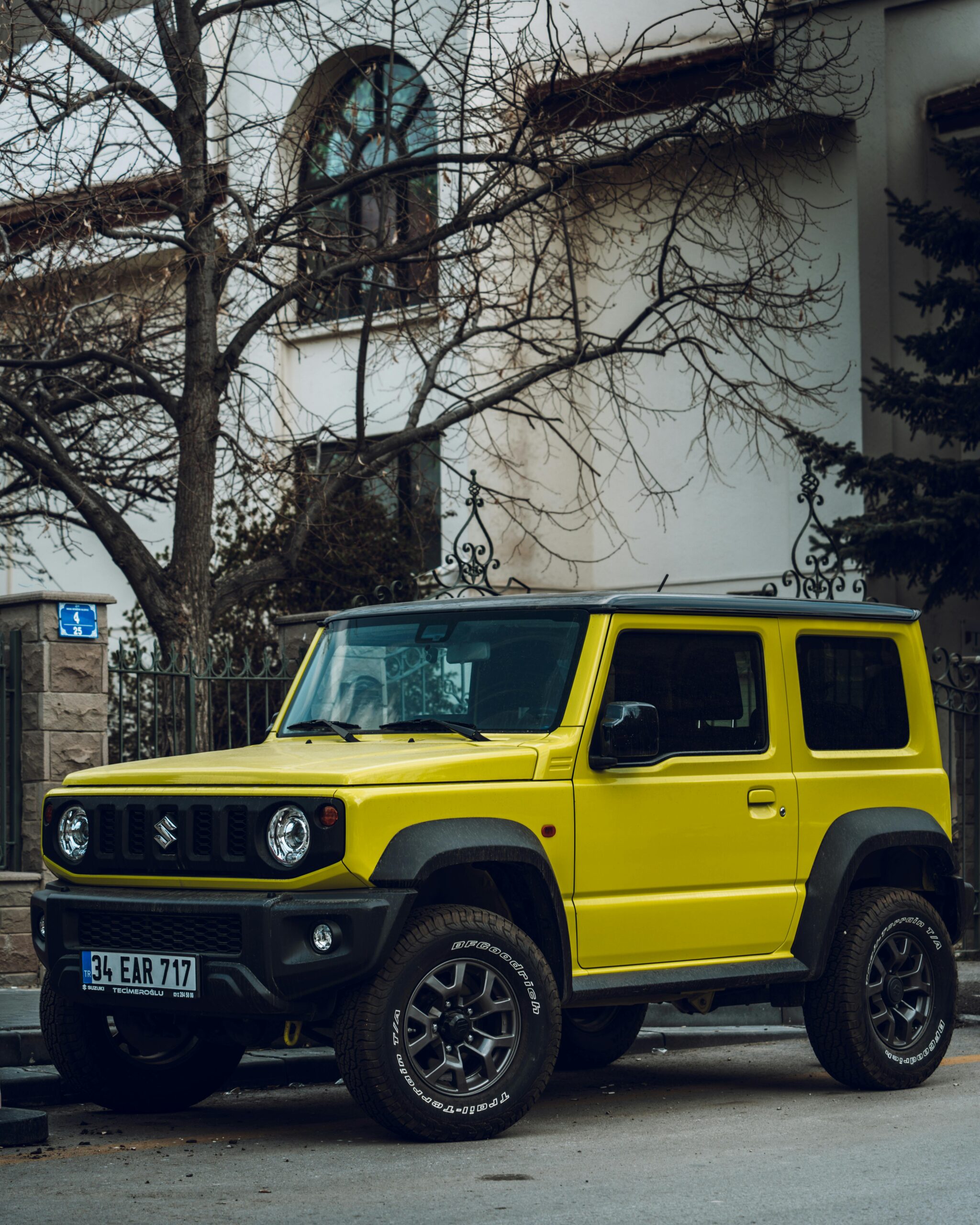 A sleek compact car navigating through city streets, showcasing its maneuverability and urban appeal.
